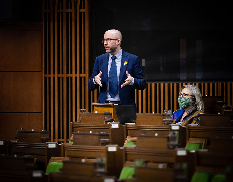 Photo of Mike standing in the House of Commons
